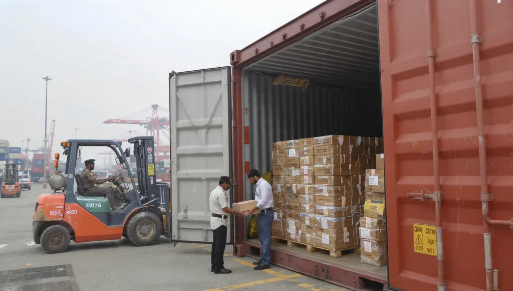 Customs inspection of imported cargo at Indian port causing clearance delays and additional handling charges.